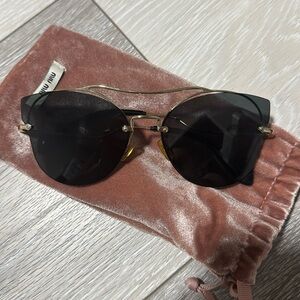 Miu Miu Black Sunglasses with Gold Details